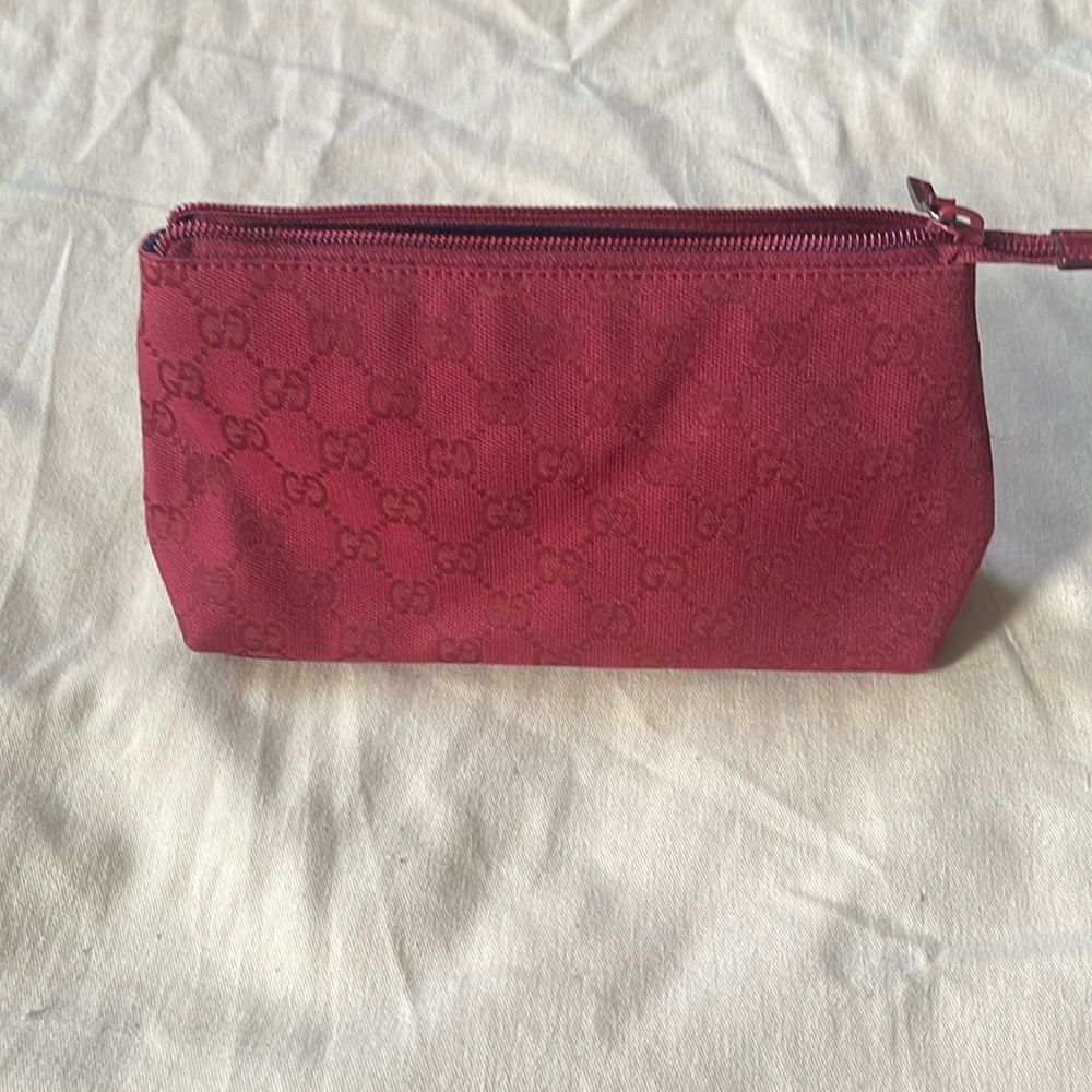 Gucci small cosmetic bag.